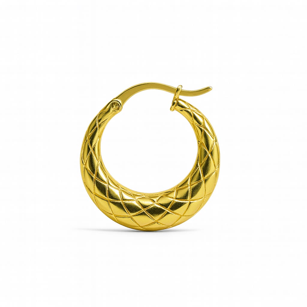 Gold tone stainless crescent hoop earring with quilted texture and hinged wire closure on white background